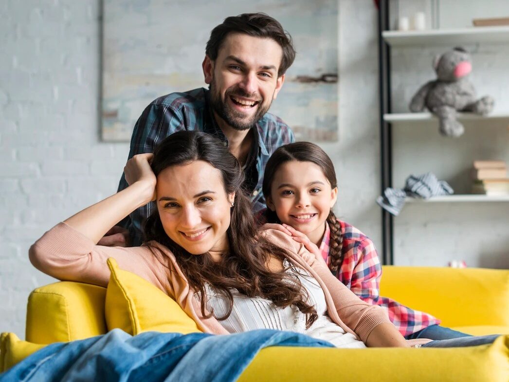 imgi 59 happy family sitting couch living room 23 2148456279